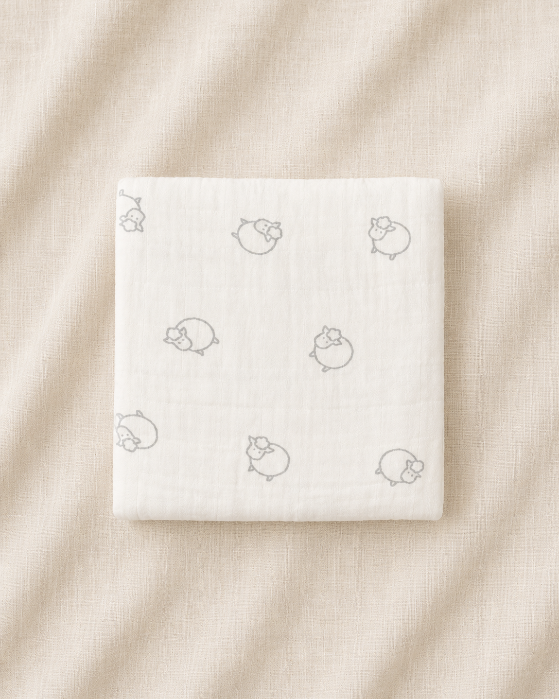 White product packaging with small icons on a beige fabric background